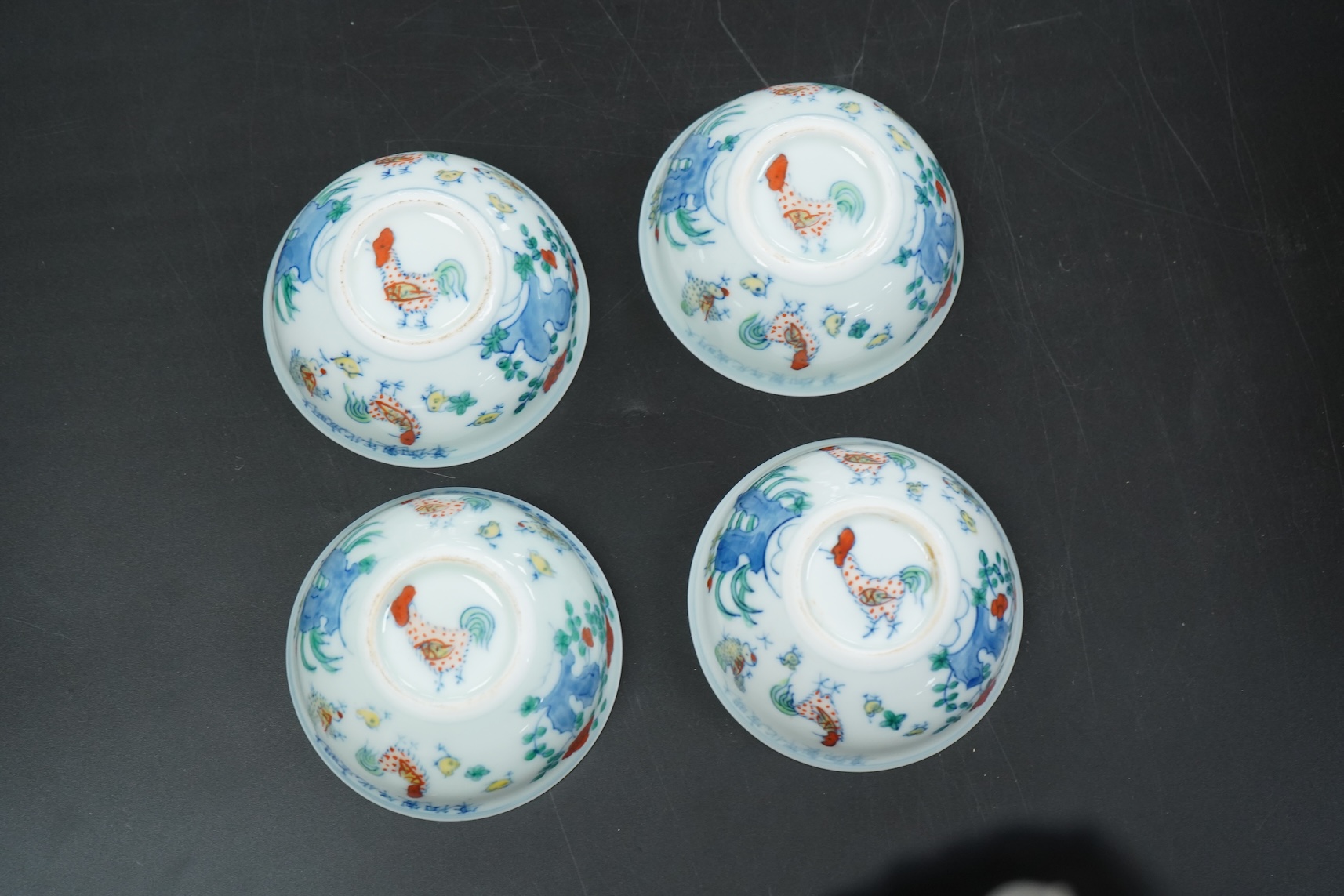 Four Chinese porcelain Wucai tea bowls, 8cm in diameter